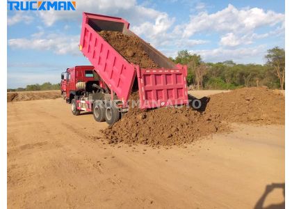 How Is The Dump Truck Unloading ?